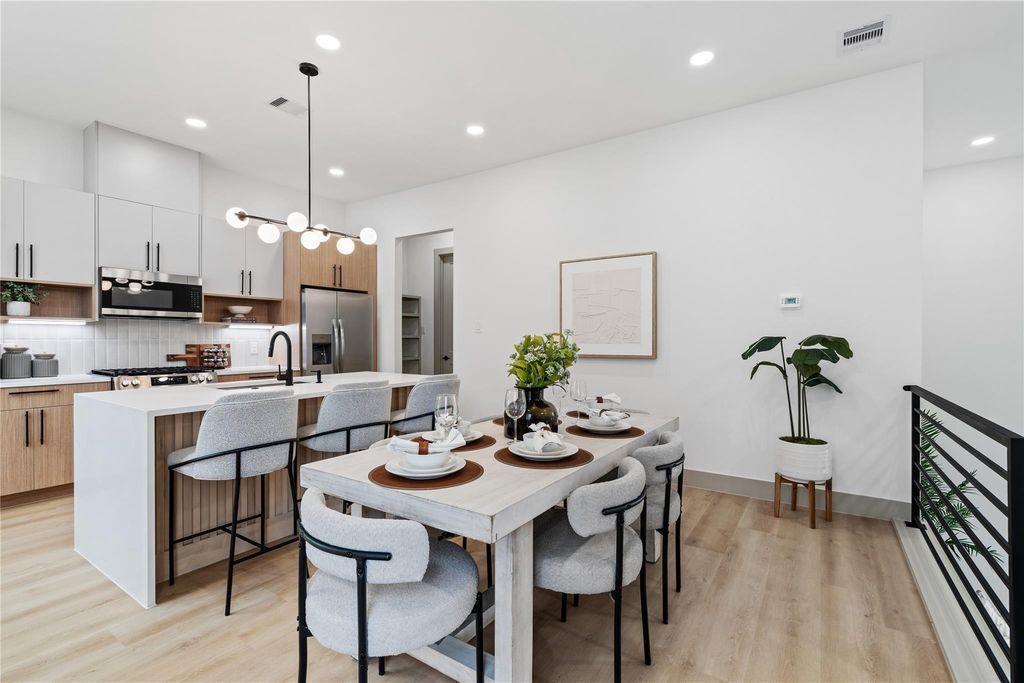 Angled ceiling lines and well-placed window openings give the bedroom a sense of volume and light, reinforcing a calm, airy atmosphere without visual clutter.