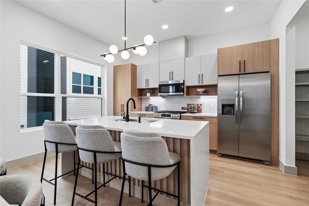 A concept rendering illustrating how this residence’s private outdoor space could transform into an entertainer’s retreat — complete with tiered lounging zones, ambient lighting, and seamless indoor-outdoor flow. The possibilities are endless.